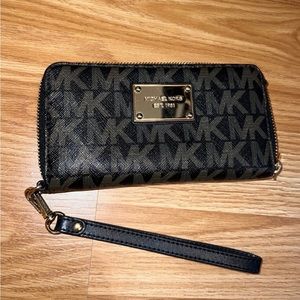Michael Kors wallet with wrist strap.